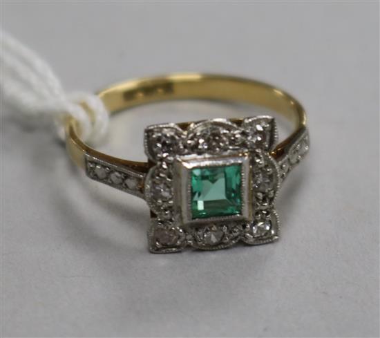 A mid 20th century 18ct gold, emerald and diamond set tablet ring, size M.